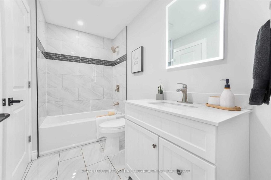 newly built bathroom, vanity, toilet and bathtub